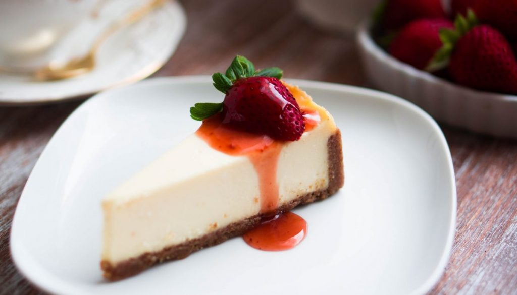 Strawwberry cheesecake on rustic background